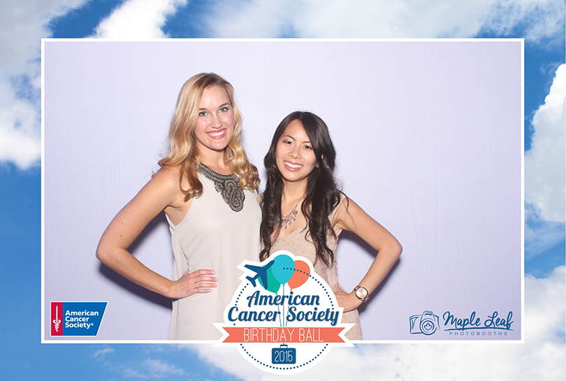 a photo booth photo with white backdrop of a photo booth rental at a fund raiser