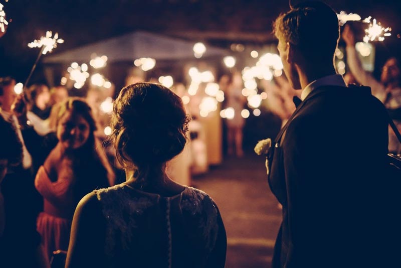 a couple entering for their wedding reception