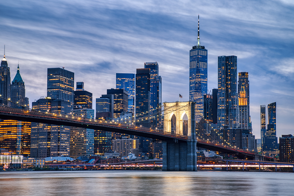 New,York,City,Manhattan,Downtown,With,Brooklyn,Bridge,At,Dusk,